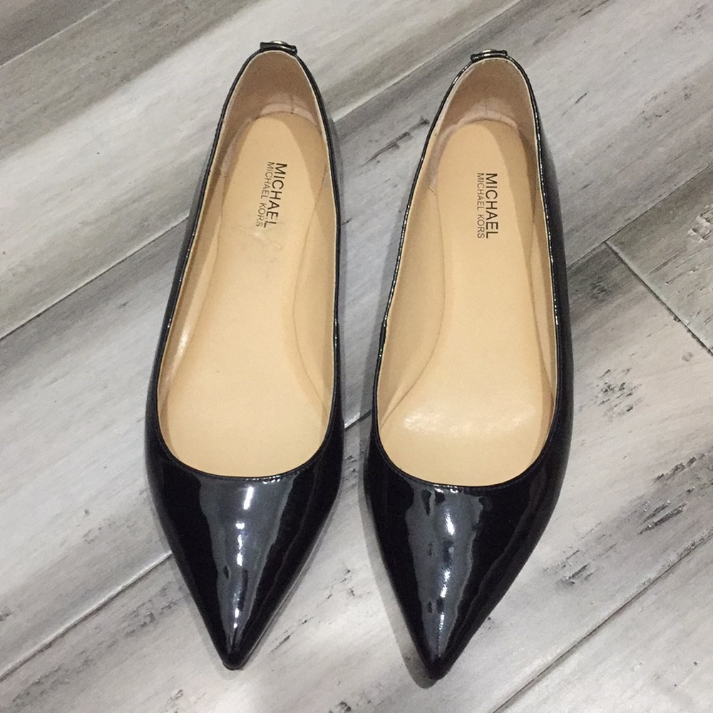 MK, Black glossy flats.